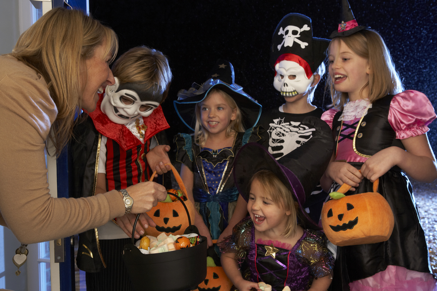 Image of children trick or treating for Halloween candy.