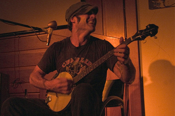 Image of Paul James playing banjo.