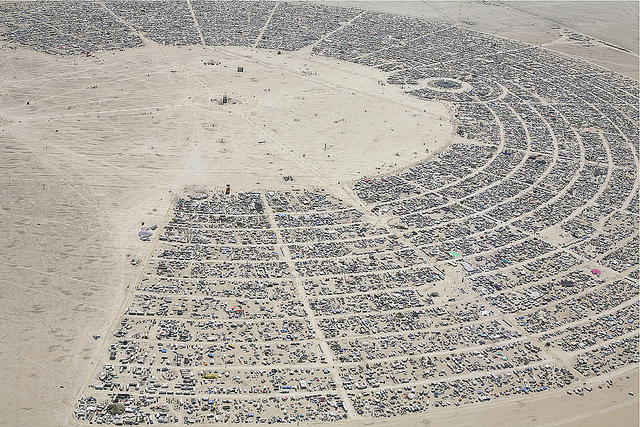 Image of half moon on desert at Burning Man