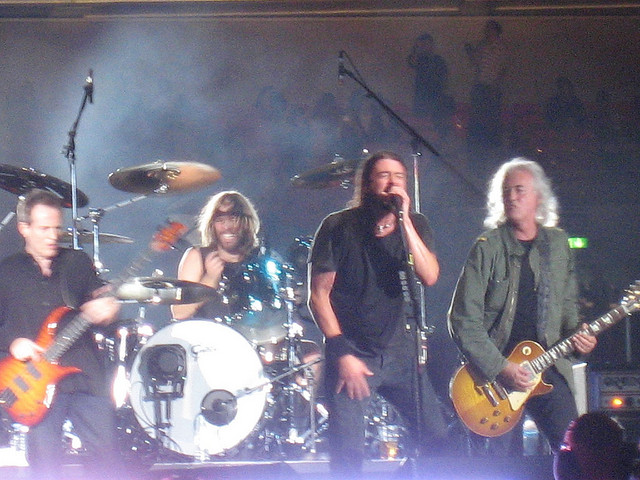 Image of Foo Fighters band group in concert.