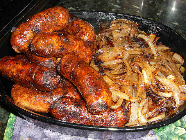 Image of grilled sausages on an outdoor grill.