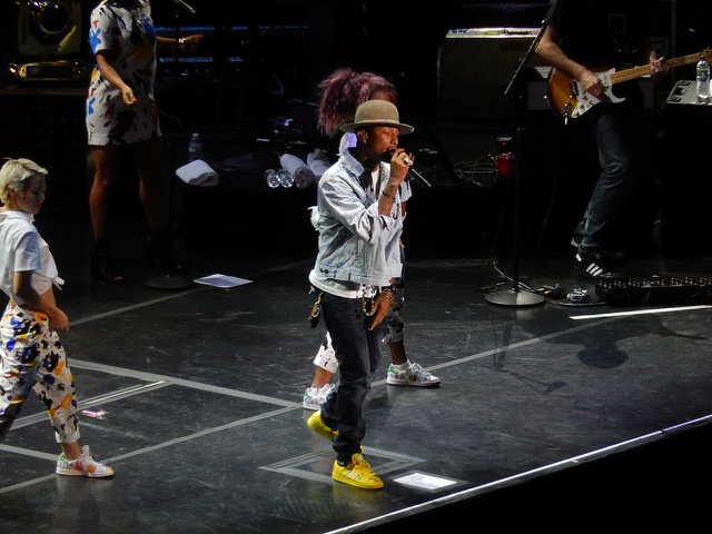 Image of Pharrell Williams in concert.