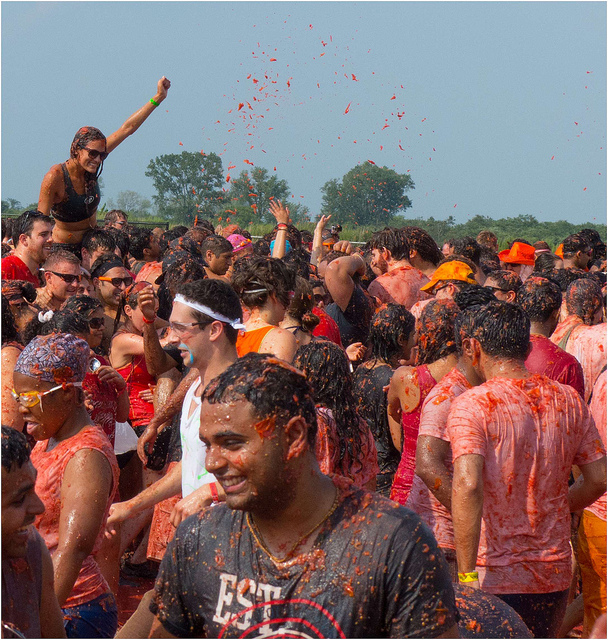 Image of tomato covered participants at Tomato Battle.